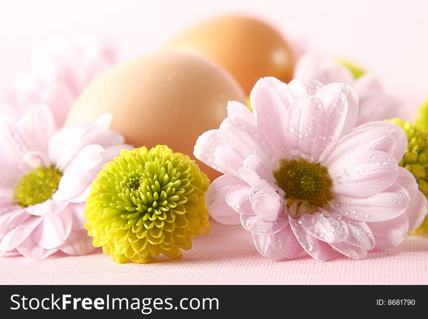Easter eggs with fresh flowers