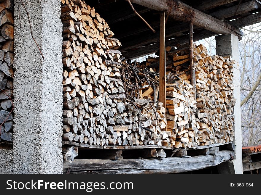 A lot of Stacked logs in the attic