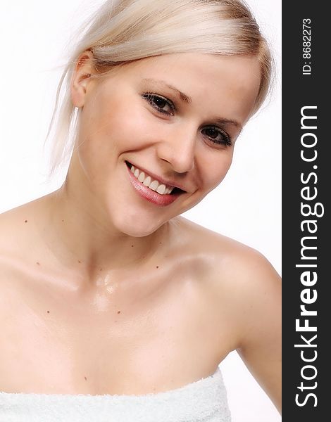 Girl's happy face after showering, and cosmetic treatment.