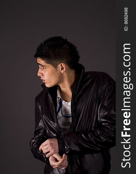 Fashion portrait of teenager over grey background