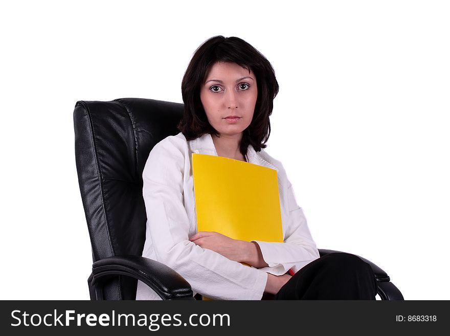 Young business woman sitting on the chair and holding a report. Young business woman sitting on the chair and holding a report