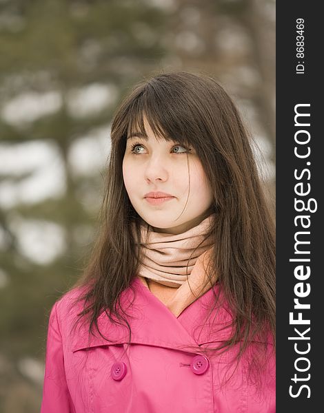 A portrait of sad young woman in the spring park looking up. A portrait of sad young woman in the spring park looking up