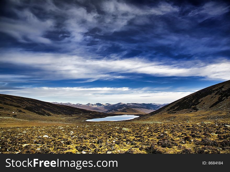 Lake and snow mountain in pamirs. 
xinjiang, china. Lake and snow mountain in pamirs. 
xinjiang, china.