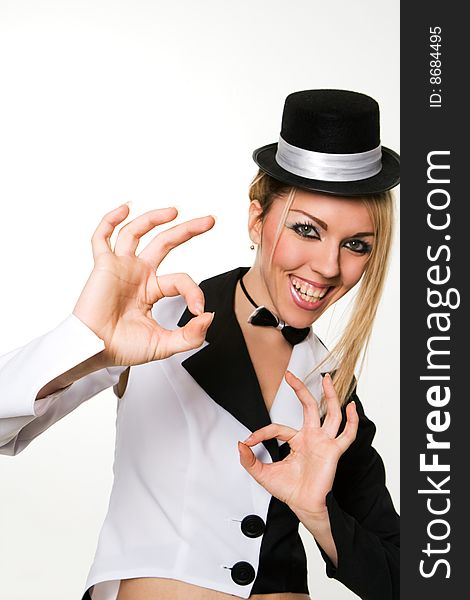 woman with small top hat making 'ok' gesture. woman with small top hat making 'ok' gesture