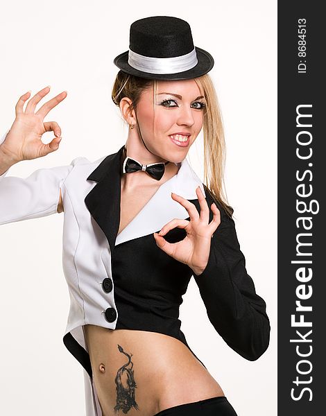 Sexy woman with small top hat making 'ok' gesture. Sexy woman with small top hat making 'ok' gesture