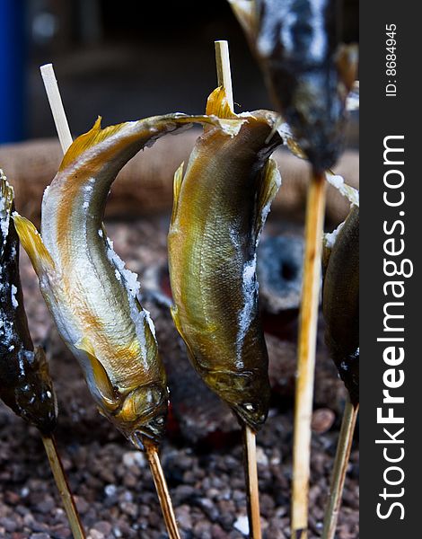 Small fried fishes on sticks