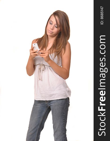 Young teen holding and talking on the phone. Young teen holding and talking on the phone