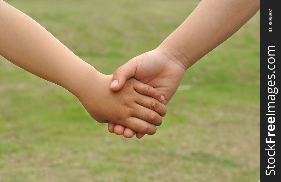 Childrens hand in hand close-ups