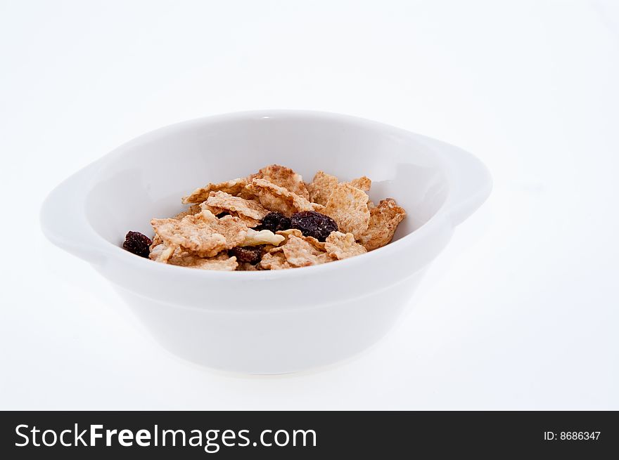 Bowl with cornflakes isolated on white