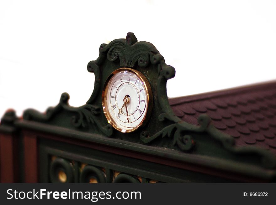 A clock on  the pediment of a building. A clock on  the pediment of a building
