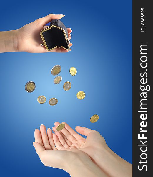 Coins falling to hands over blue background. Coins falling to hands over blue background.
