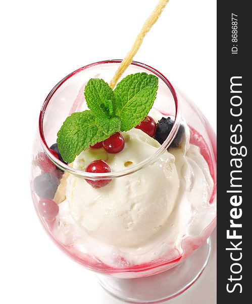 Dessert - Ice Cream and Fresh Berries in the Glass. Isolated over White