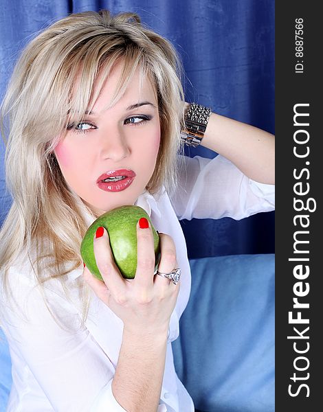 Lovely girl with apple in room