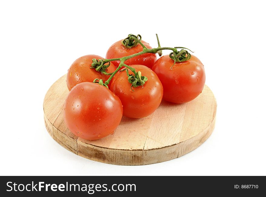 Five tomato on chopping board