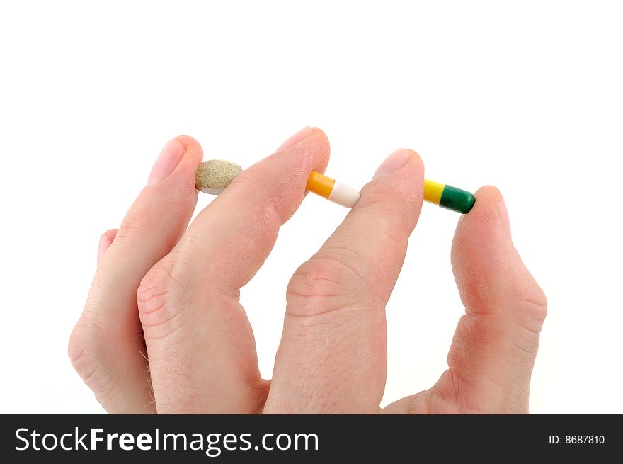 A Human finger holding Medicine