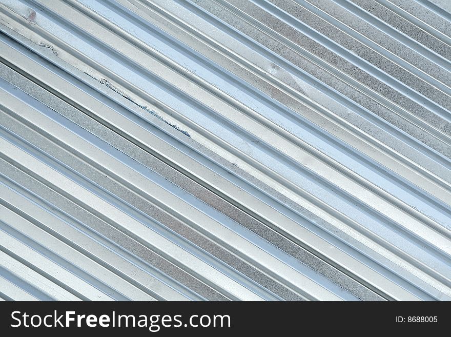 The gray metal ribbed surface. The gray metal ribbed surface