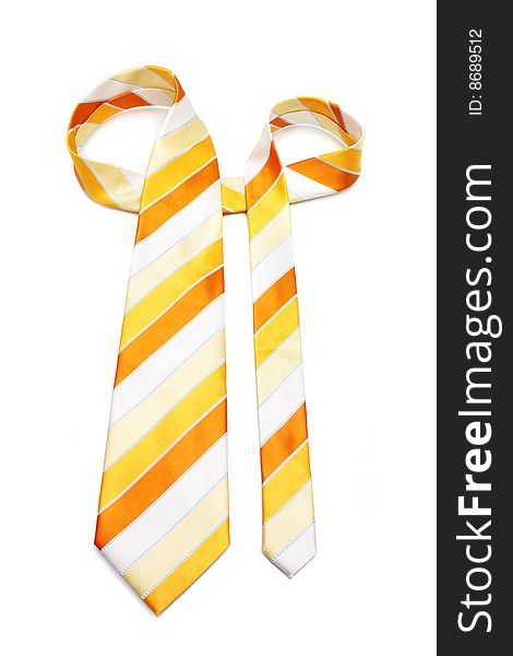 An orange necktie with stripes on white background. An orange necktie with stripes on white background.