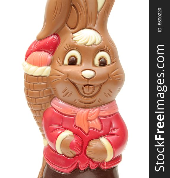 Chocolate happy Easter bunny carrying egg