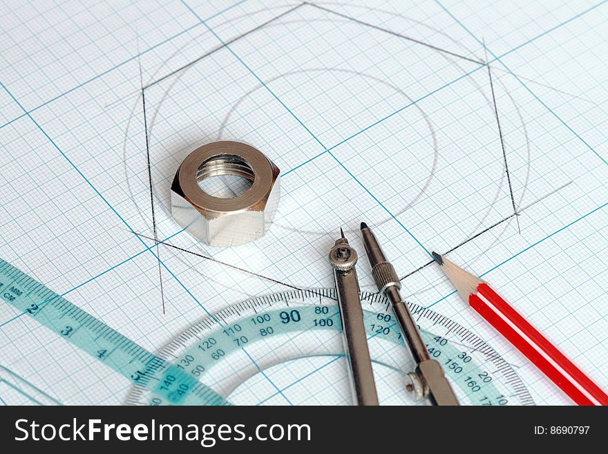 Drawing tools lying on background with graph paper. Drawing tools lying on background with graph paper