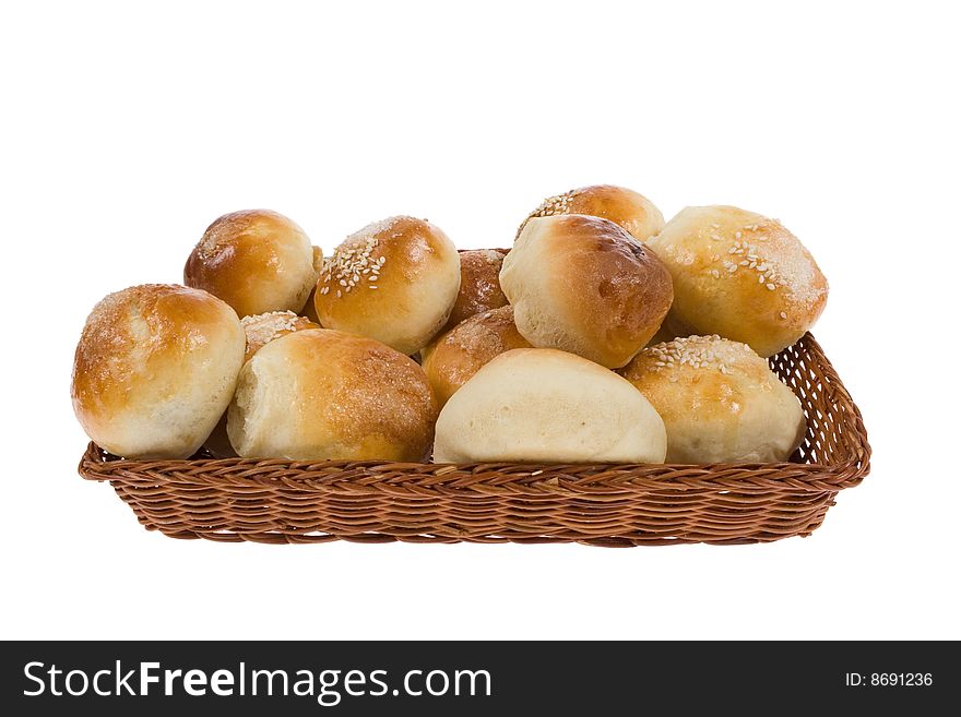 Sweet with sesame seeds on white backgroundbuns in basket. Sweet with sesame seeds on white backgroundbuns in basket