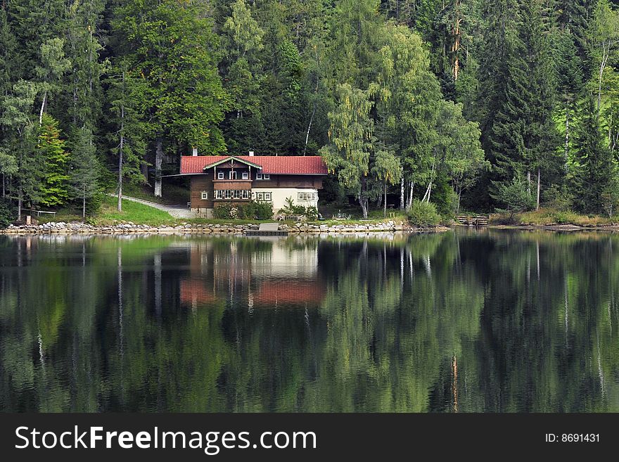 Home Reflection In Lake