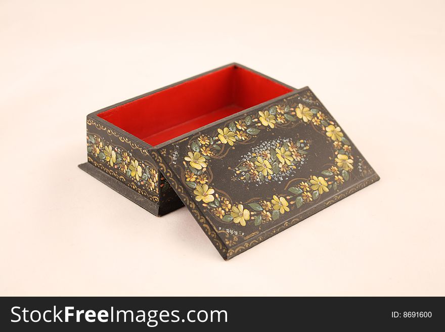 Black casket painted with flower patterns in national style. Black casket painted with flower patterns in national style