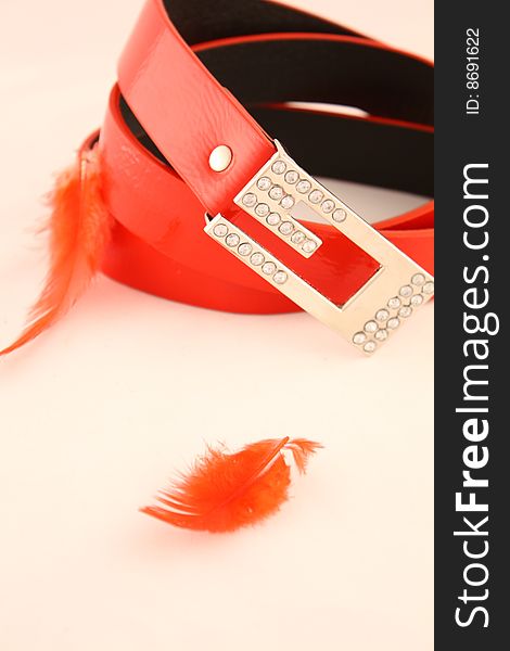 Red glamour belt with a silver buckle it is isolated on the white
