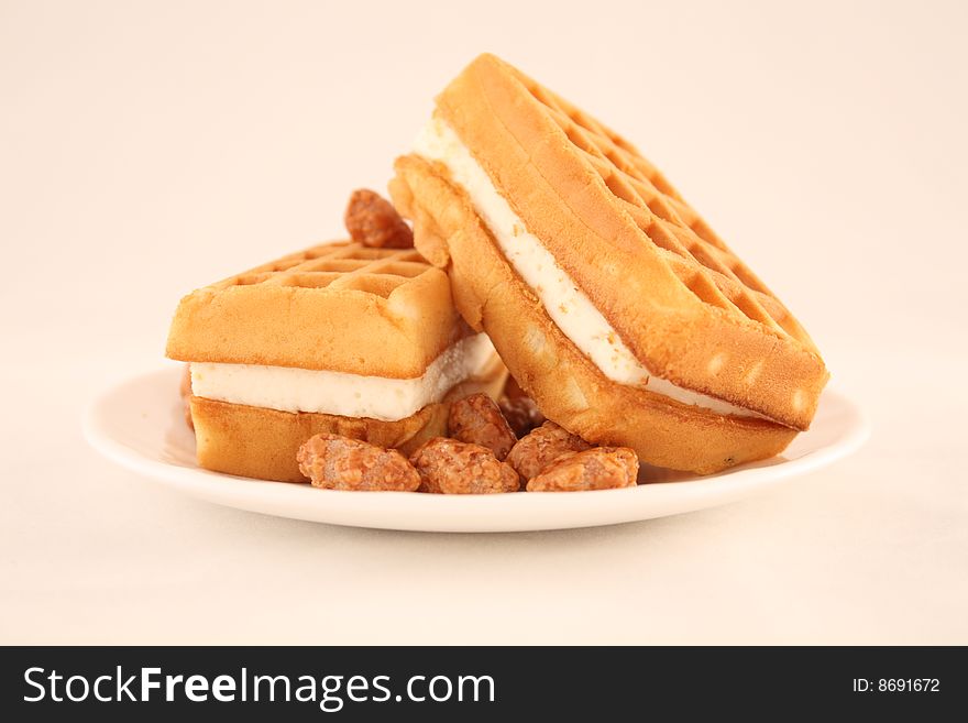 Wafers with a peanut in sugar lie on a plate