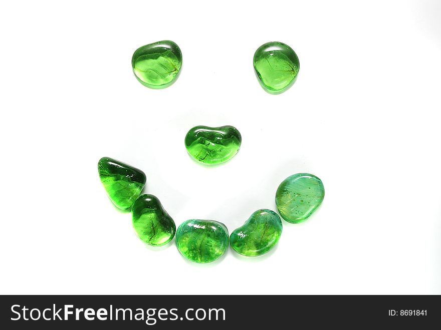 Smile, made of green stones. Smile, made of green stones