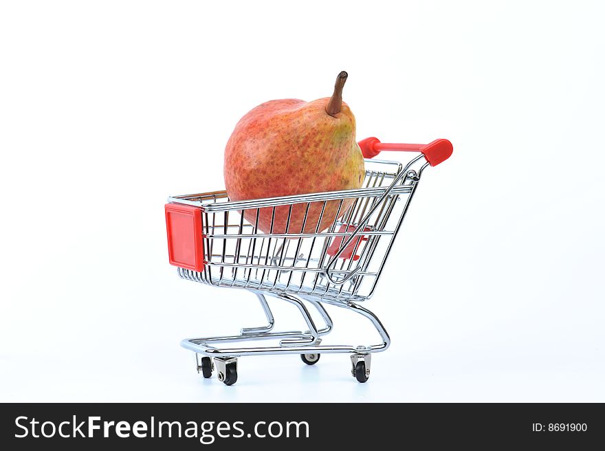 Pear in shopping basket isolated