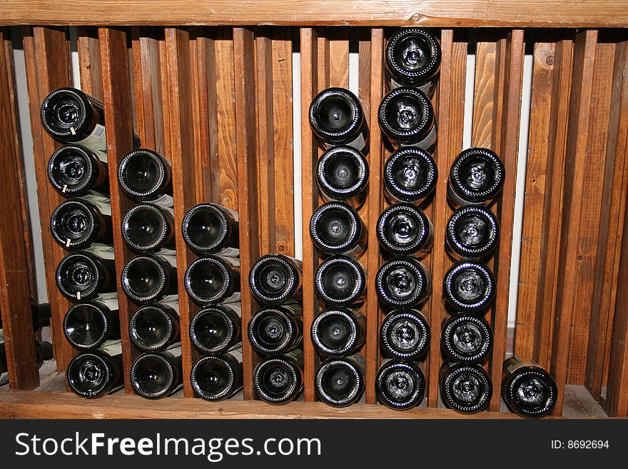 Wooden rack with bottles of wine. Wooden rack with bottles of wine