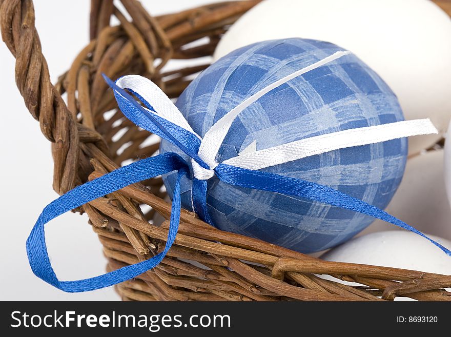 Easter eggs in a basket - blue egg