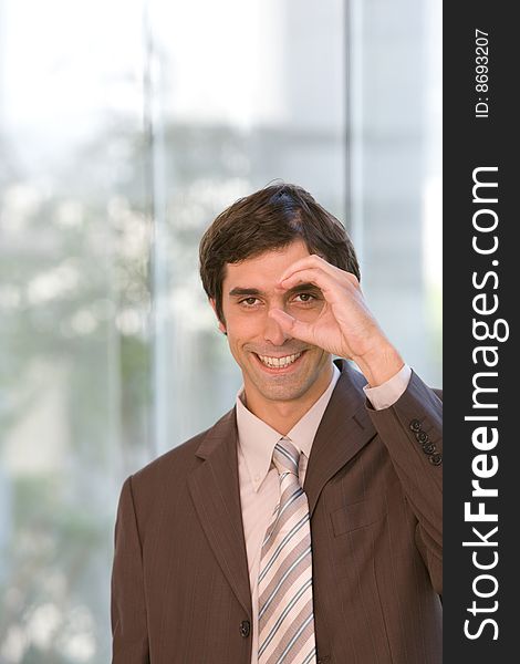 Portrait of young confident business man in focus. Portrait of young confident business man in focus.