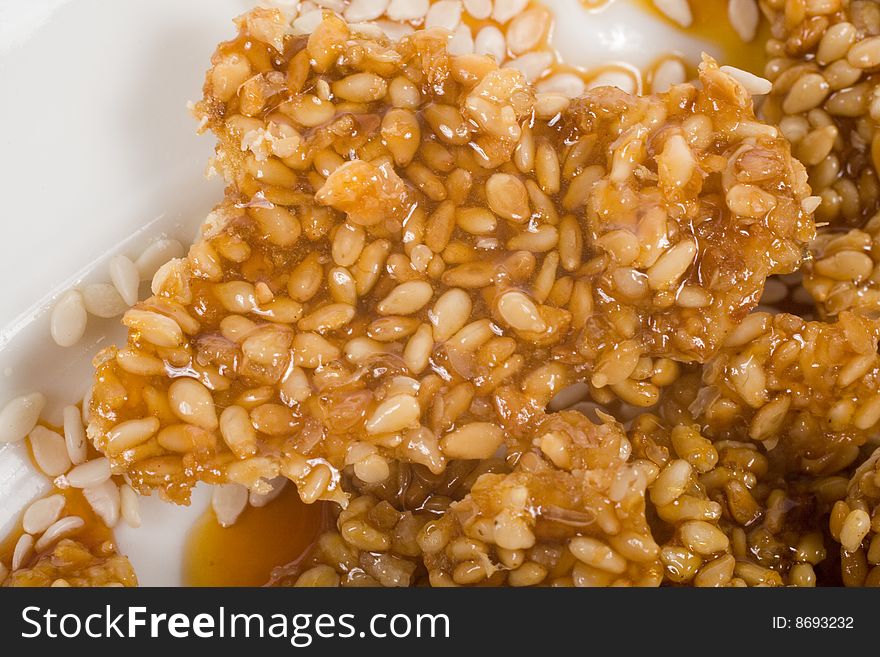 Close up tp sweet sesame seeds on white background