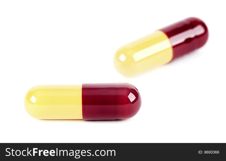 Capsules filled with medicine on a white background