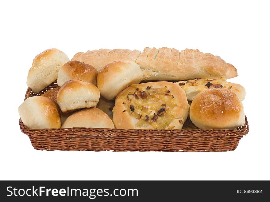 Bakery goods in basket on white background