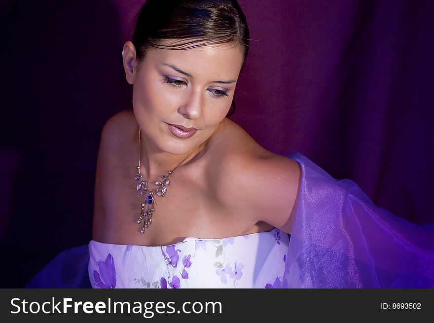 Picture of a model in violet colors. Picture of a model in violet colors.