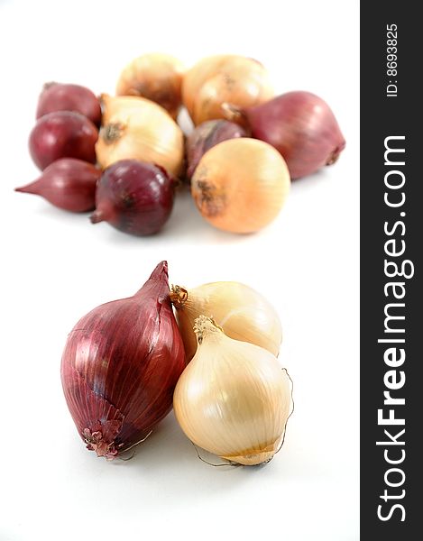Red and yellow onion on white background
