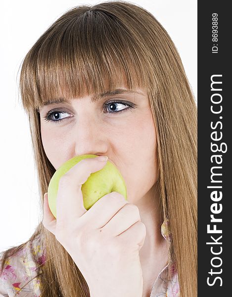 Young blue eyes girl with green apple. Young blue eyes girl with green apple.