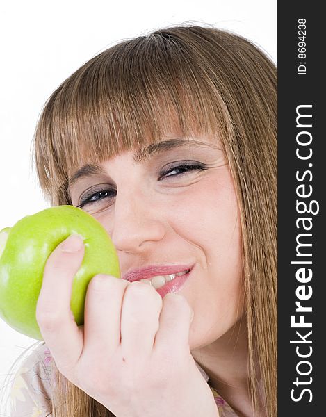 Young blue eyes girl with green apple. Young blue eyes girl with green apple.