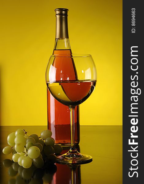 Bottle and glass of wine with grapes. Bottle and glass of wine with grapes