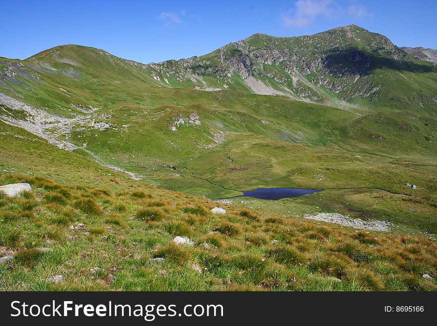 Pond in Carpathian Mountains in Romania (Rodney Mts). Pond in Carpathian Mountains in Romania (Rodney Mts)