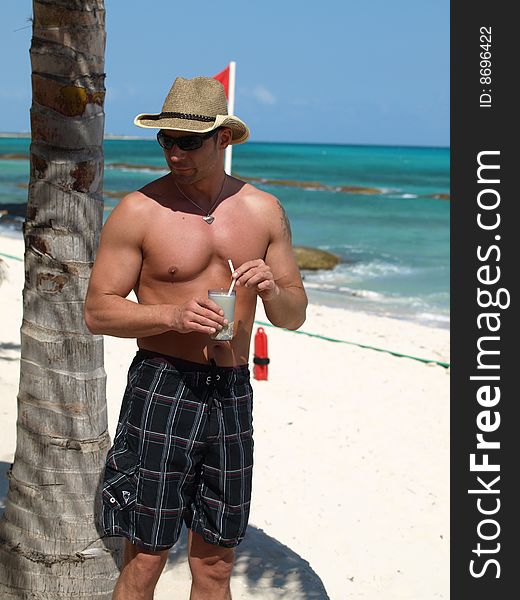 Handsome young man,good physical development relaxing on the beach before his big wedding day.watch this site for more wedding pictures. Handsome young man,good physical development relaxing on the beach before his big wedding day.watch this site for more wedding pictures.