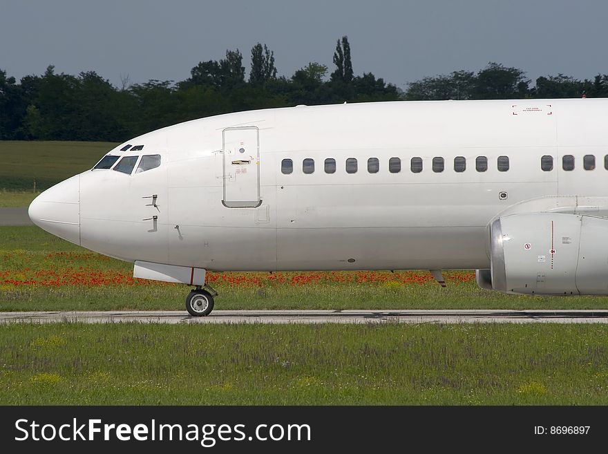 Jet airplane is taxiing prior to departure. Jet airplane is taxiing prior to departure