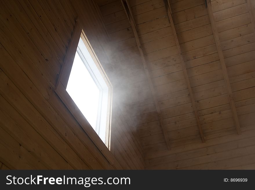 Light and steam coming through a window