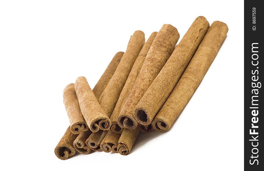 A stack of cinnamon sticks isolated on white background with copy space