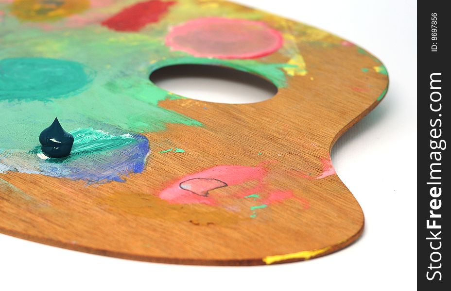 Wooden palette with single dob of paint. Wooden palette with single dob of paint