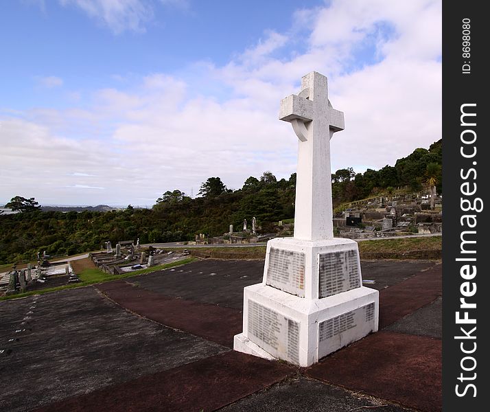 Photo of a cemetery scene with sky in the background. Photo of a cemetery scene with sky in the background