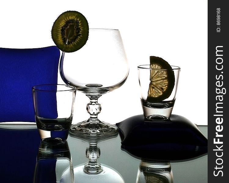 Set of the liquor-glasses on glass surface