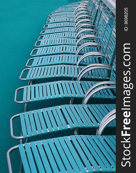 Deckchairs around swimming pool on a cruise ship